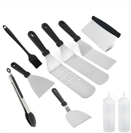 Set of kitchen utensils including spatulas and a tong on a white background