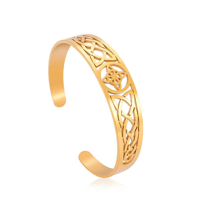 Gold bracelet with intricate design on a white background