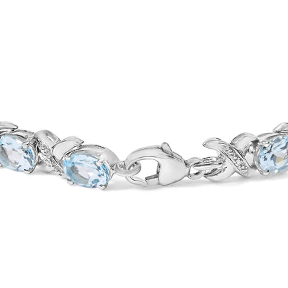 Style Loft Collection .925 Sterling Silver 16.0 Ctw Oval Blue Topaz and Diamond Accent Tennis X Link Bracelet (I-J Color, I1-I2 Clarity) - Size 7" Inch