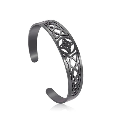 Black metal Celtic knot bracelet on a white background